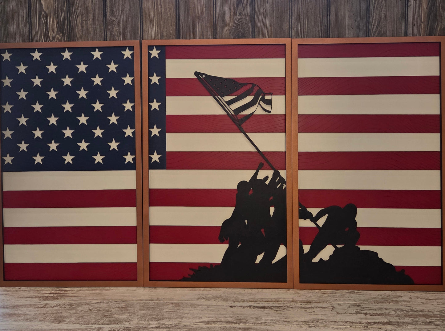 Wooden wall art with American flag design and Iwo Jima Memorial silhouette.