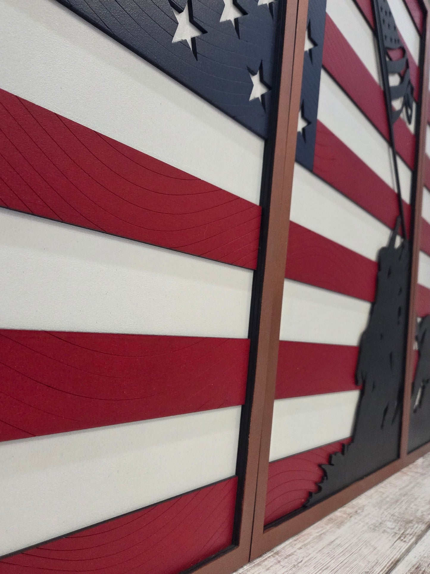 3-piece wooden American flag wall art with Iwo Jima soldier silhouette, handcrafted in layered wood with red, white, and blue design. Veteran-made patriotic home décor.